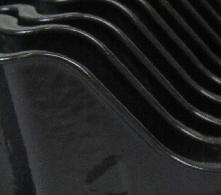 nested black curved metal parts nested black curved metal parts